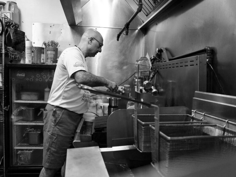 Chef Elie Ghanem cooking in the kitchen at That Lebanese Place, preparing authentic Lebanese dishes with care and tradition.