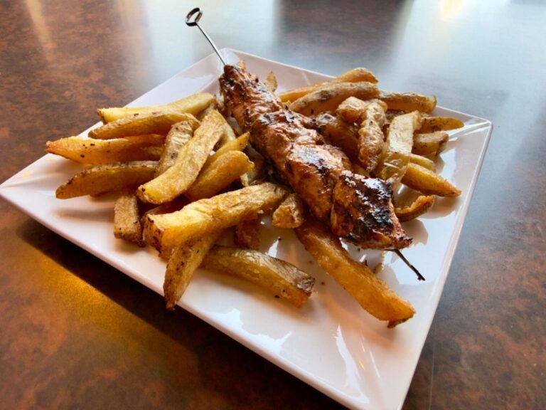 Kids meal from That Lebanese Place featuring a grilled chicken skewer served with golden fries.
