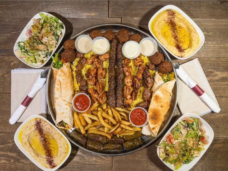 The Family Tray from That Lebanese Place featuring a large platter of grilled meats, falafel, hummus, salads, and sides — perfect for sharing with friends and family.