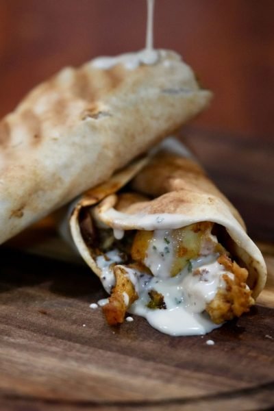 Chicken Shawarma Wrap from That Lebanese Place, filled with marinated chicken, garlic sauce, and vegetables wrapped in warm pita bread.