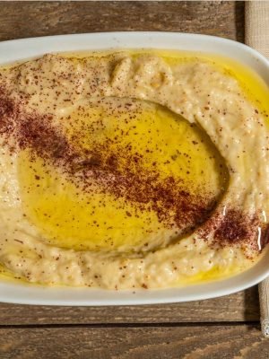 Creamy Lebanese hummus drizzled with olive oil and sprinkled with sumac, served fresh at That Lebanese Place.